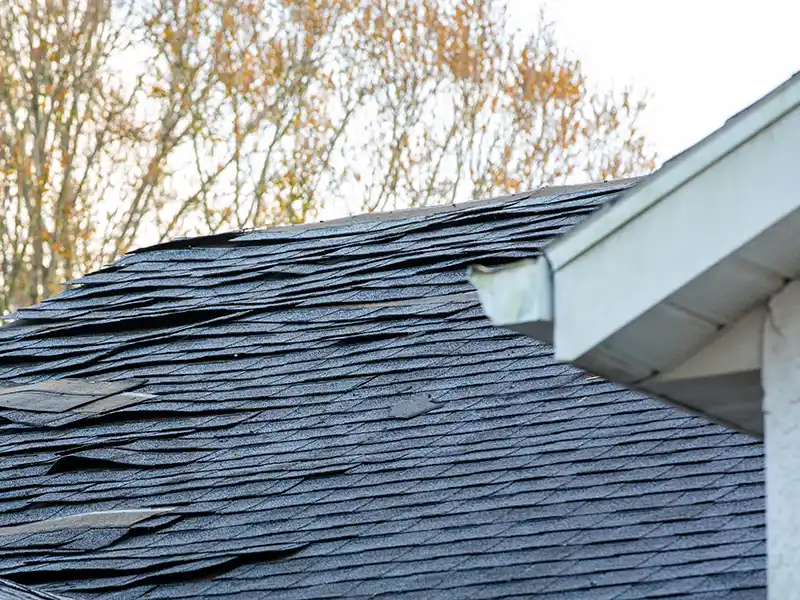 Damaged shingles from a storm