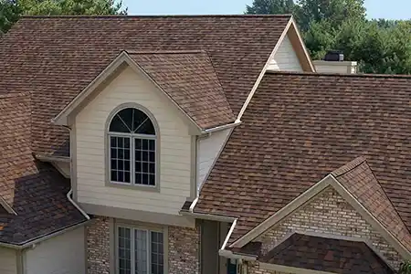 Modern, mid-class home with dark red shingles